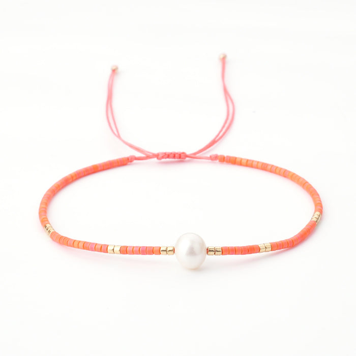 Coral-Colour Brads and Freshwater Pearl Bracelets