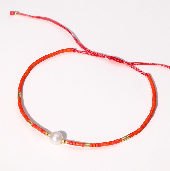 Coral-Colour Brads and Freshwater Pearl Bracelets
